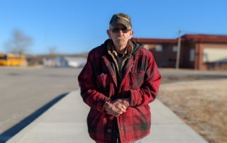 James stands in line at a One Generation Away mobile food pantry distribution, telling the story of how he forgot his entire life and rebuilt it.