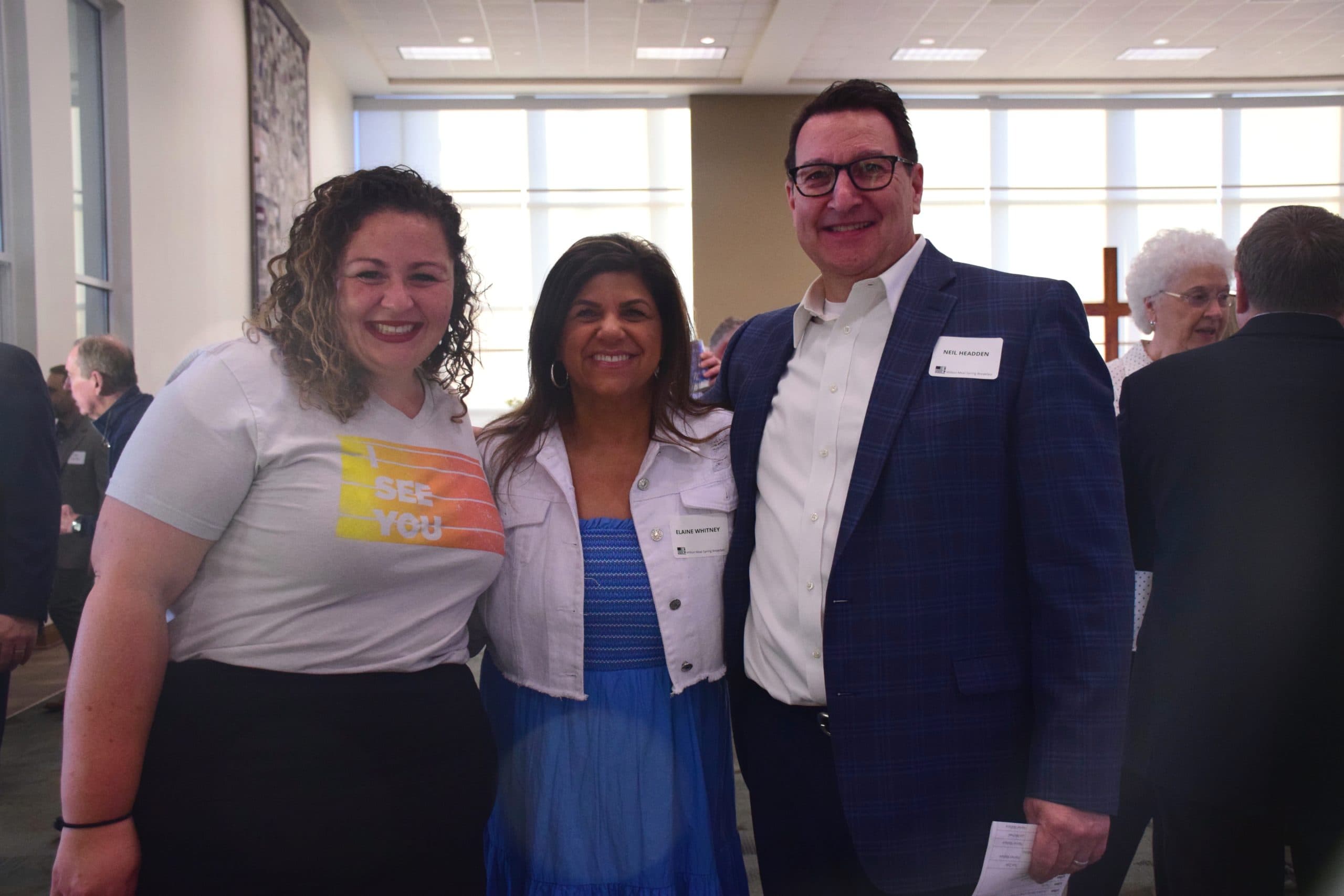 Bree Barnett, Elaine Whitney, and Neil Headden pose for a photo at the 2022 Million Meal Spring Breakfast