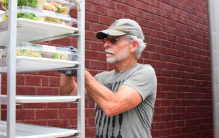 OneGenAway's First Responder Mark rescues food from a grocery store.